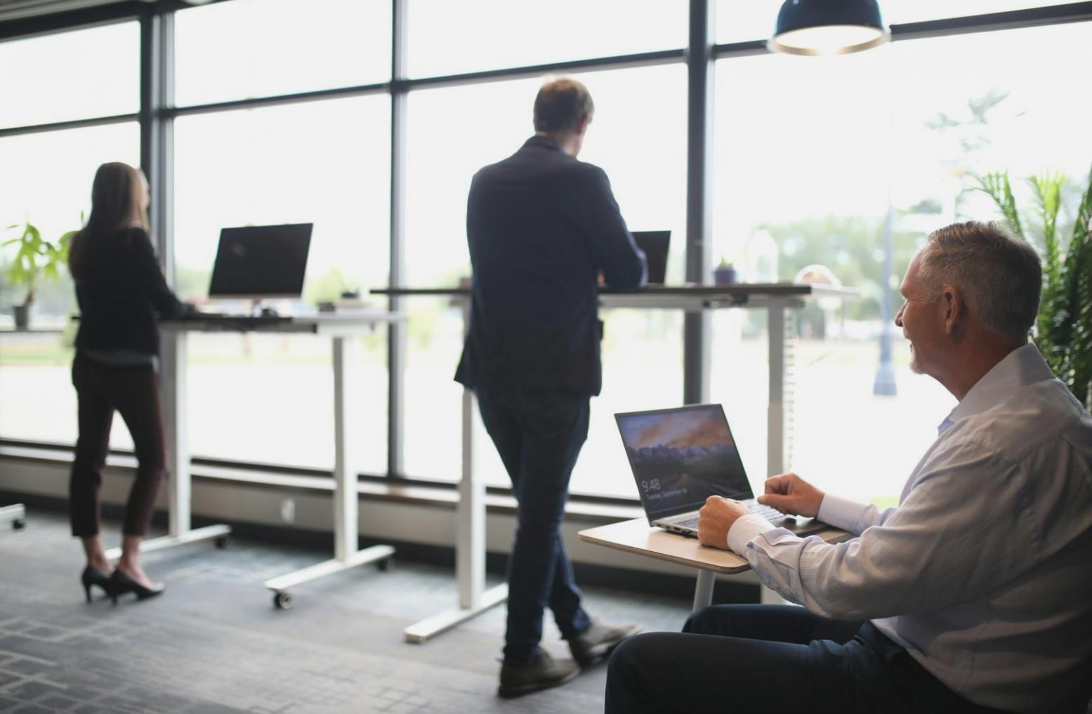 Detailed financial analysis and business model documentation spread across a workspace